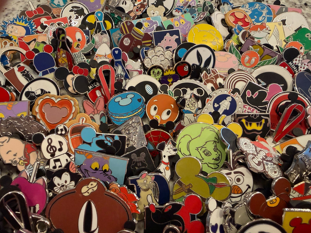 Disney pin collection display showing authentic trading pins from Disney Parks